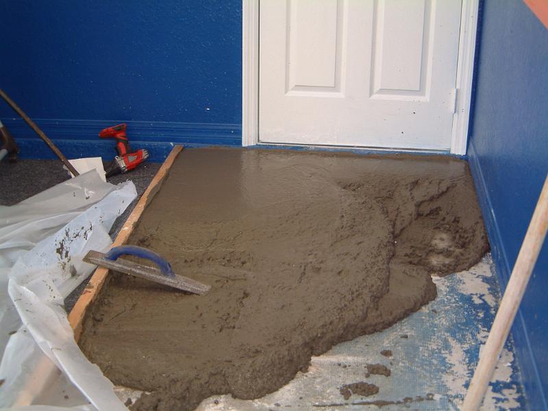 03Carpet Covered in Plastic and Ramp Being Poured.JPG